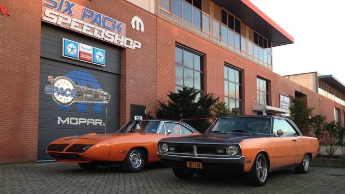 1973 Dodge Dart next to 1970 Plymouth Superbird at SixPack Speedshop