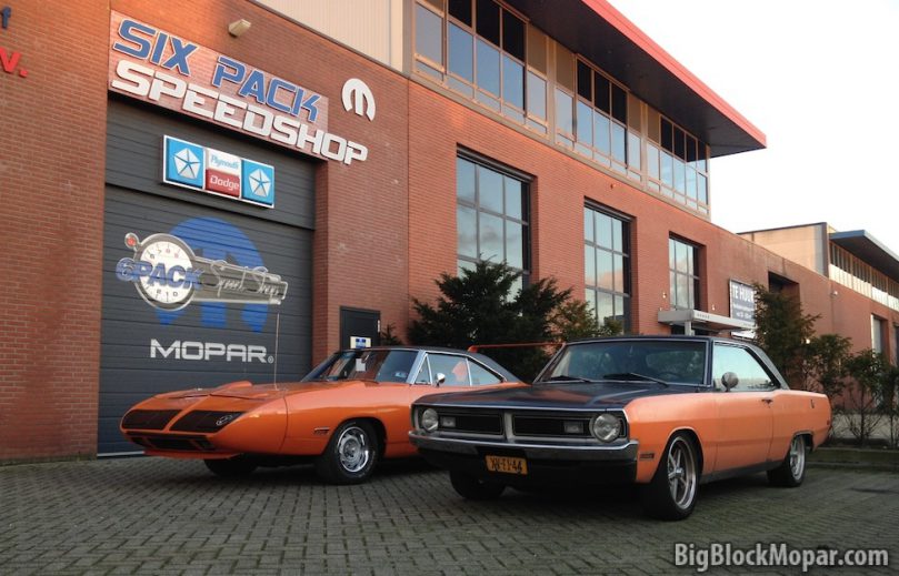 1973 Dodge Dart next to 1970 Plymouth Superbird at SixPack Speedshop