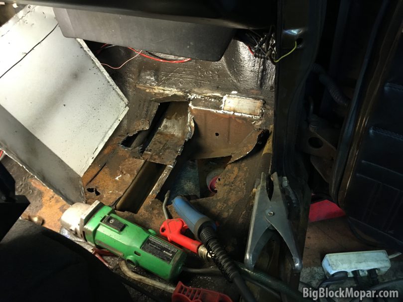Picking and grinding away the floorboard and most of the rust and holes.